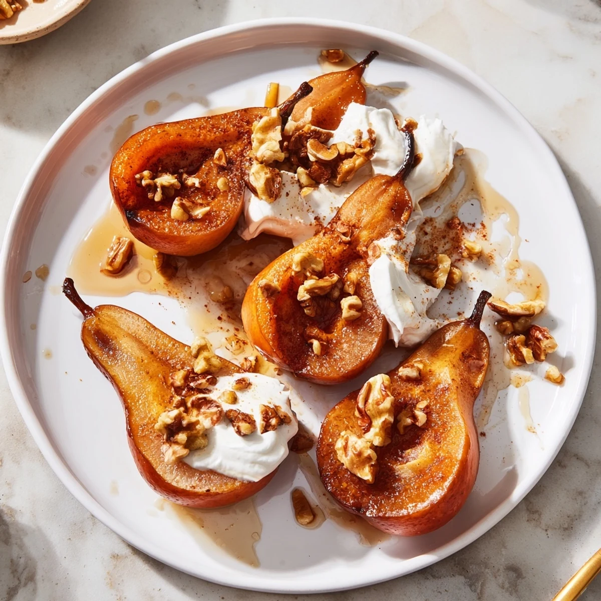 Warm roasted pears with cinnamon, walnuts and Greek yogurt, offering a delightful creamy, crunchy texture.