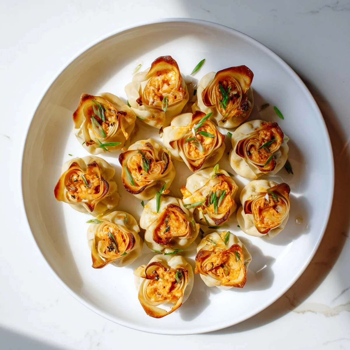 Golden and crispy Buffalo Chicken Dip Pinwheel Wontons, a crowd-pleasing appetizer with flavorful, cheesy filling.