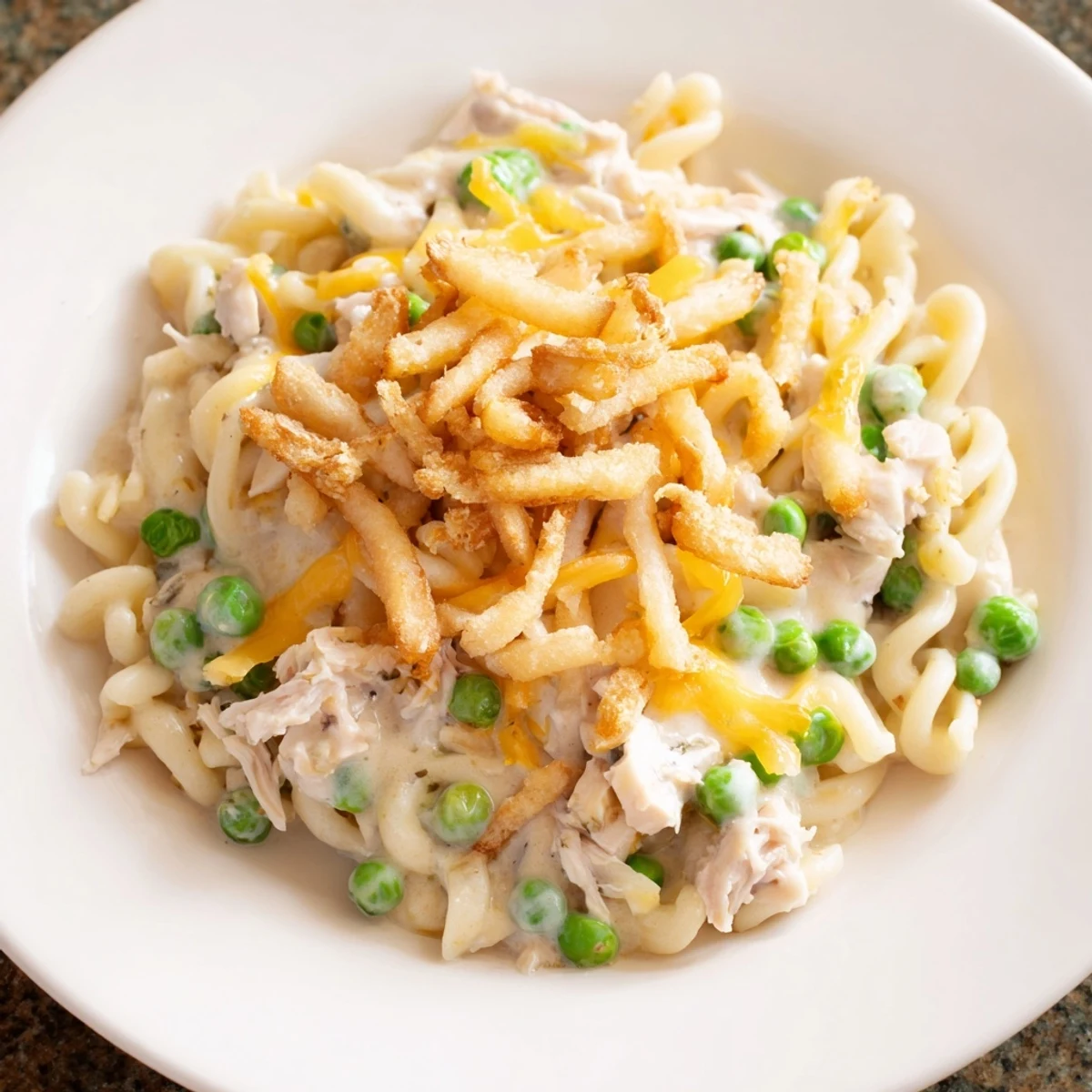 A close-up view of a family-favorite Creamy Tuna Noodle Casserole, ready to be served hot.