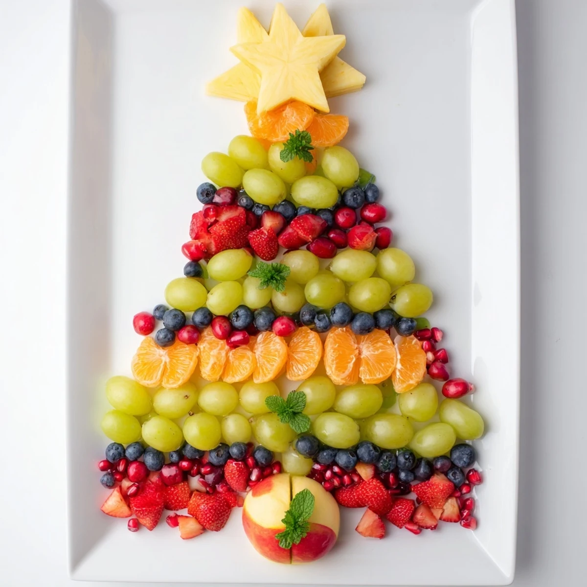 Delicious Quick Christmas Tree Fruit Platter showcases fresh, seasonal fruits, perfect for easy holiday snacking.