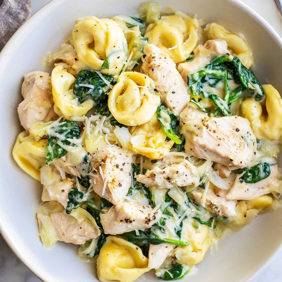 This Creamy Chicken and Spinach Tortellini shows tender chicken and perfect tortellini in a creamy sauce.