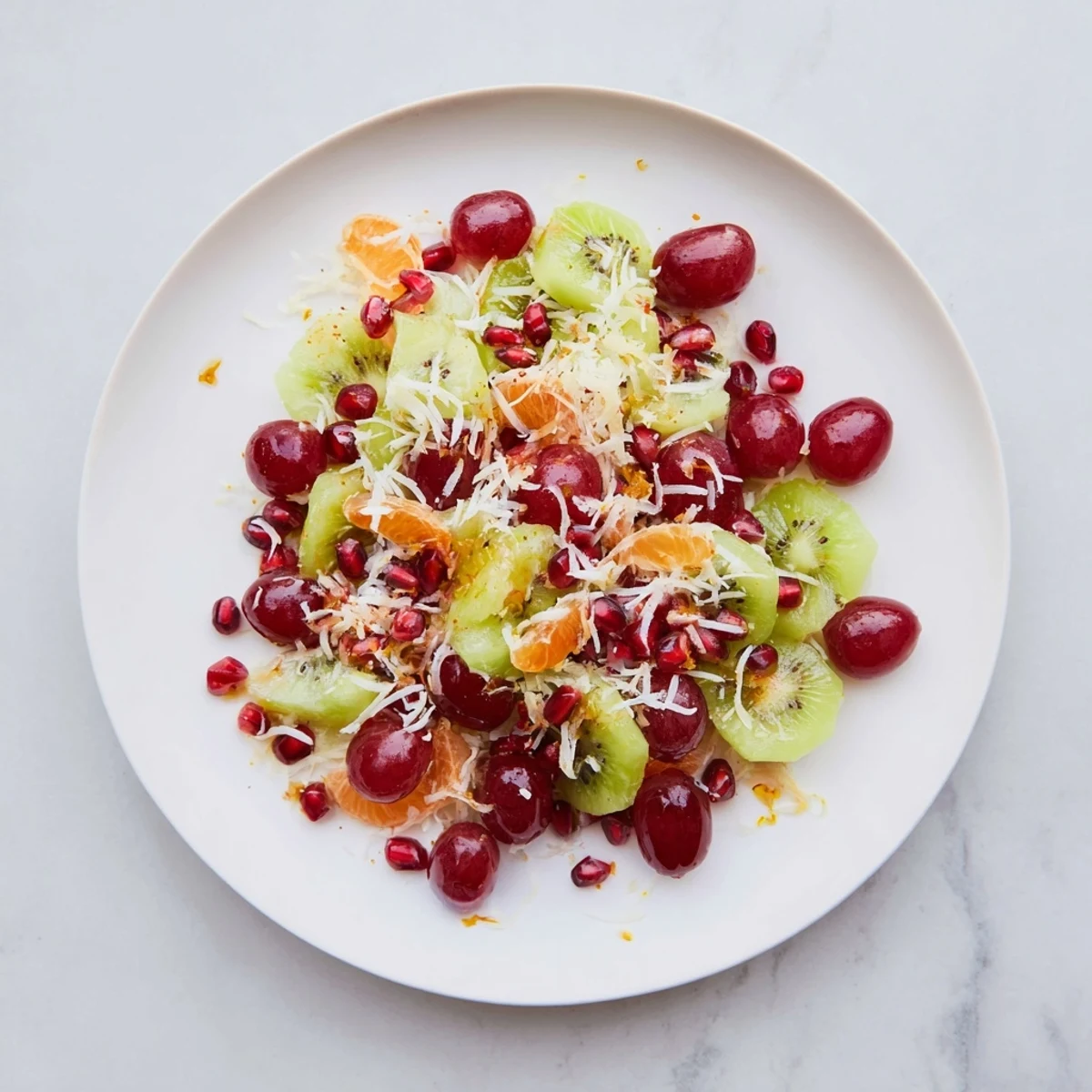 A beautifully arranged Snowflake Fruit Medley, drizzled with honey dressing and topped with fluffy coconut flakes.
