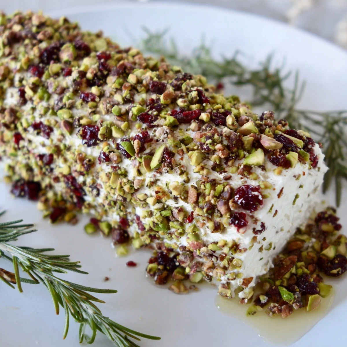 Beautifully arranged Cranberry Goat Cheese Logs, featuring a delicious appetizer with a variety of textures and flavors.