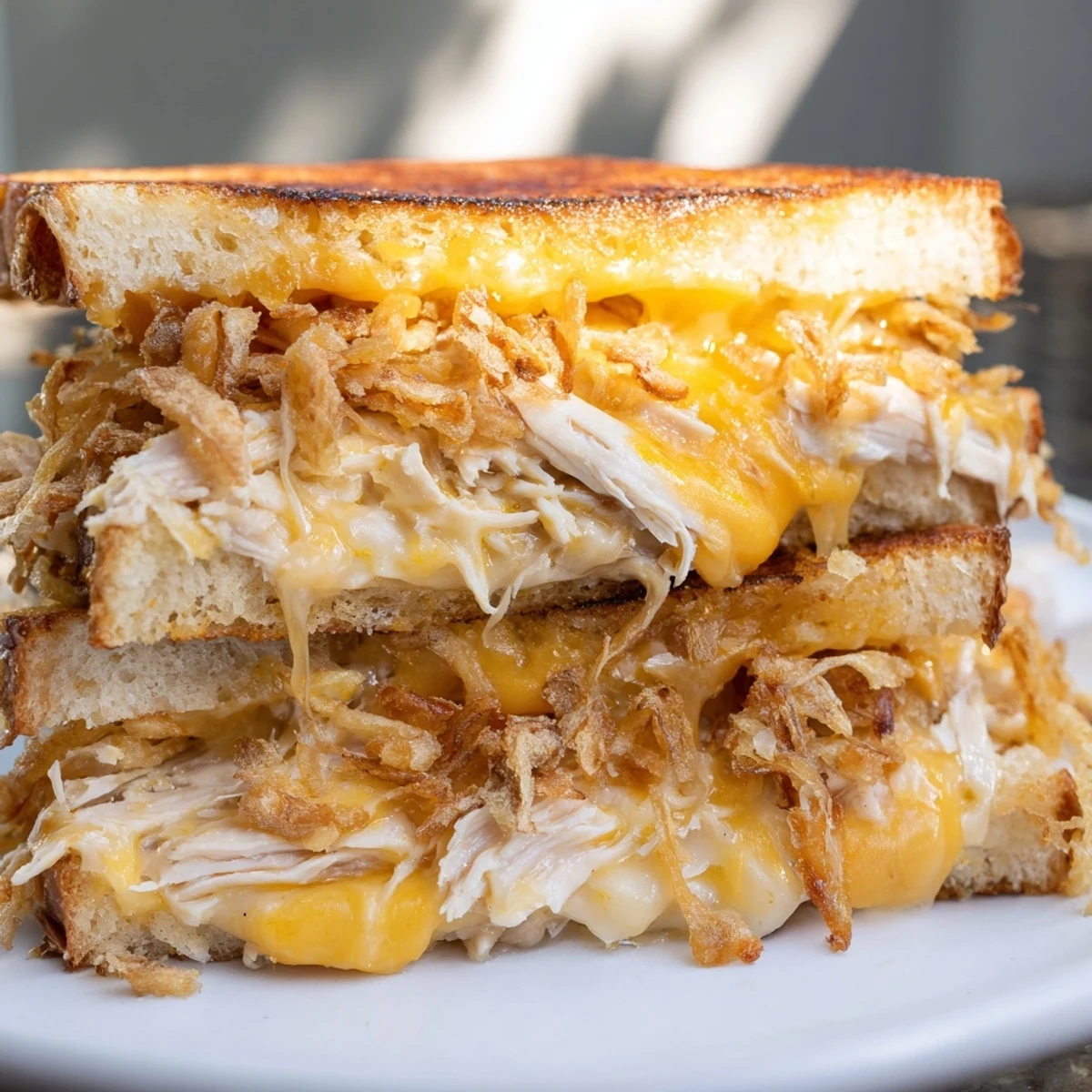 Golden-brown Crispy Shallot Chicken Grilled Cheese with melted cheese oozing out, great for lunch.