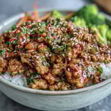 A close-up of sautéed Korean-Style Ground Turkey with a glossy, spicy-sweet sauce and aromatic garlic and ginger.