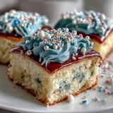 Festive sheet cake decorated with vibrant buttercream, Class of 2026 lettering, and edible glitter for graduation parties.