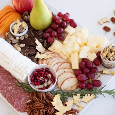 Twelve Days of Christmas Snack Board, filled with cheeses, fruits, and treats for festive sharing.