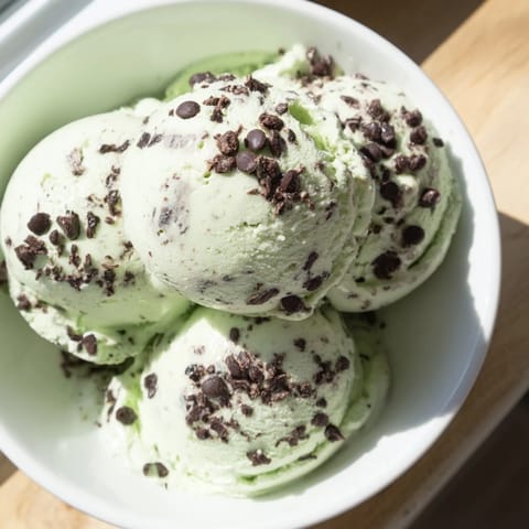 Creamy, green mint chocolate chip ice cream, dotted with dark chocolate chips, ready to devour.