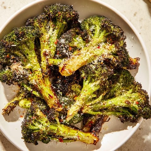 A close-up of Garlic Parmesan Roasted Broccoli, perfectly roasted with hints of garlic and cheese.
