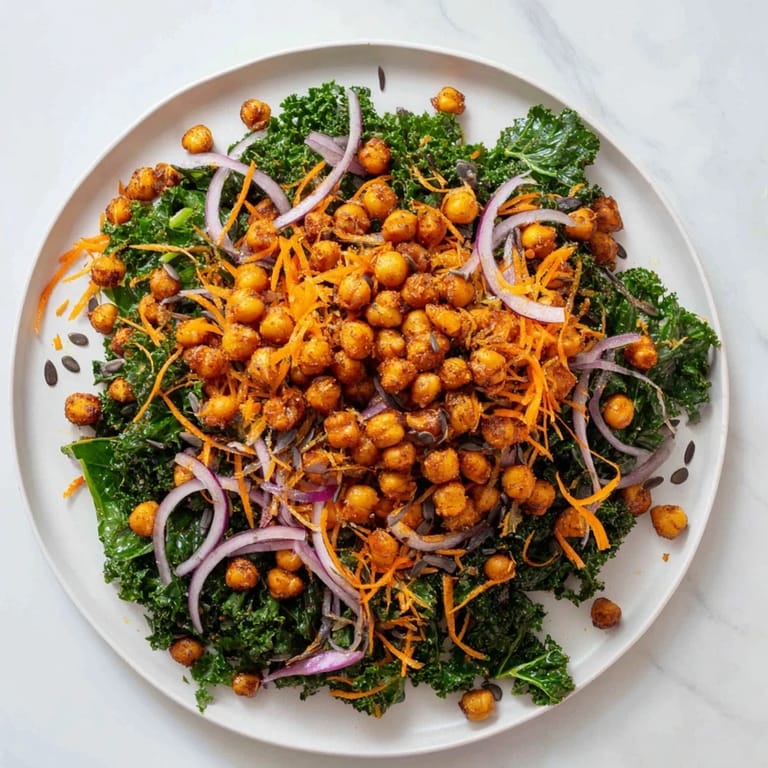 This bright Kale Salad with Roasted Chickpeas features tender kale mixed with a zesty dressing and spiced chickpeas.